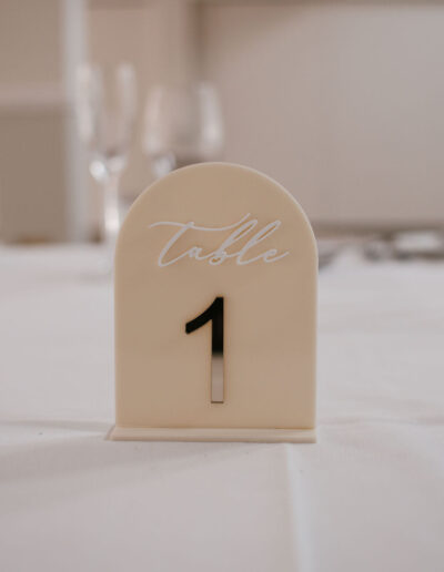 Cream arched table number with mirrored silver numeral