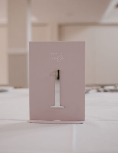 Dusky pink table number with mirrored silver numeral