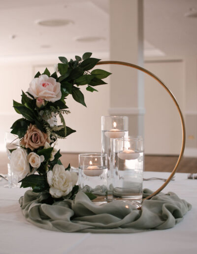 Gold hoop centrepiece with roses on sage chiffon