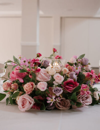 Pink, lilac and cream rose centrepiece with candle bowl