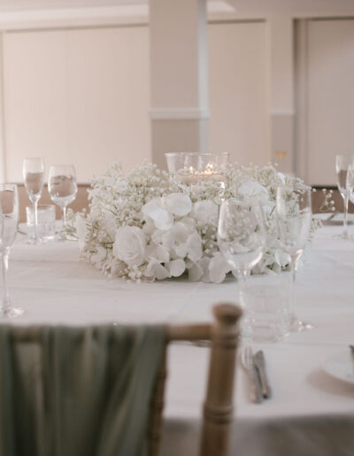 White gypsophila and orchid wreath centrepiece