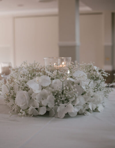White orchid, rose and gypsophila wreath with candle bowl