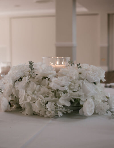 White rose and hydrangea centrepiece with candle bowl