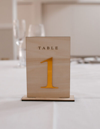 Wooden table number with mustard gold numeral